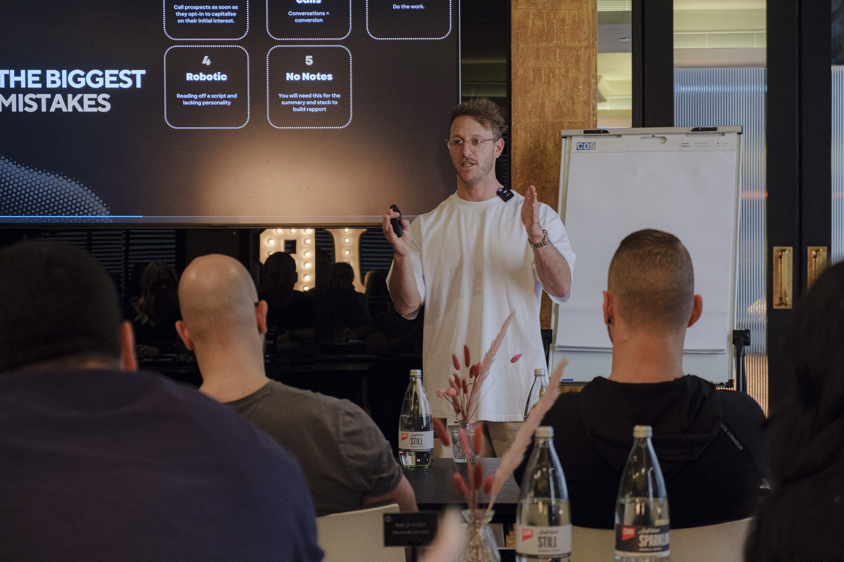 Brando teaching at a Kaizen workshop, with 'The Biggest Mistakes' slide on screen behind him